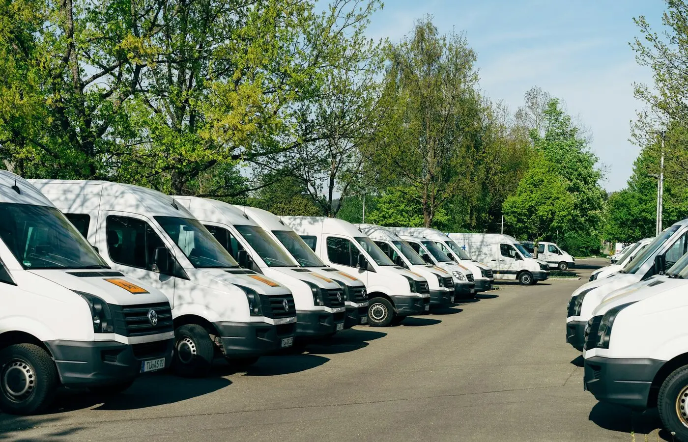 Commercial vehicle fleet arranged at a busy operations depot